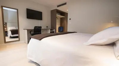 Cama o camas de una habitación en Hotel Ciudadela Pamplona