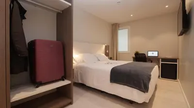 Cama o camas de una habitación en Hotel Ciudadela Pamplona