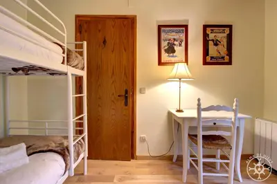 Cama o camas de una habitación en CASA AIGUAMOIX de Alma de Nieve