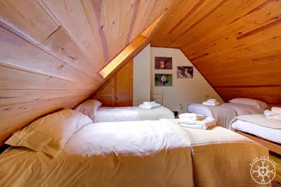 Cama o camas de una habitación en CASA AIGUAMOIX de Alma de Nieve