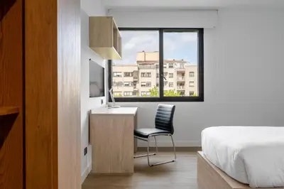 Una televisión o centro de entretenimiento en Micampus Pamplona Student Residence