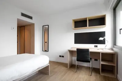 Cama o camas de una habitación en Micampus Pamplona Student Residence