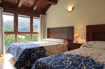 Cama o camas de una habitación en Apartamentos Irati Olaldea
