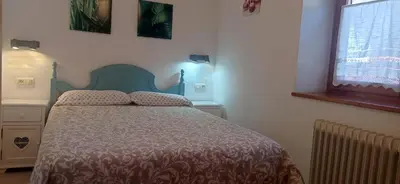 Cama o camas de una habitación en Vivienda Benasque Ibonet