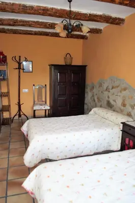 Cama o camas de una habitación en Casa Rural El Huerto del Trucho