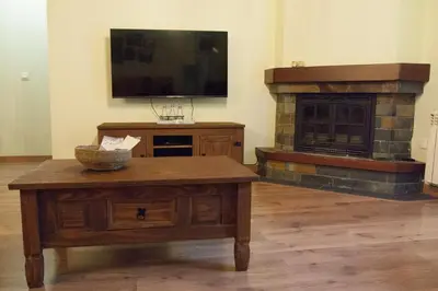 Una televisión o centro de entretenimiento en Apartamento Toran