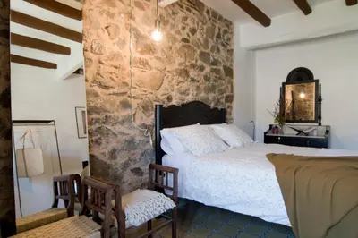 Cama o camas de una habitación en L'Hostatgeria del Celler