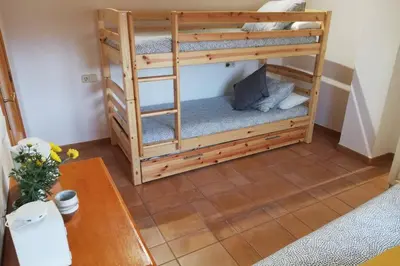 Cama o camas de una habitación en Ca l'Andròmines