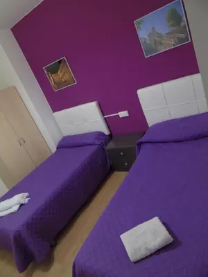 Cama o camas de una habitación en Apartamentos Mequedo
