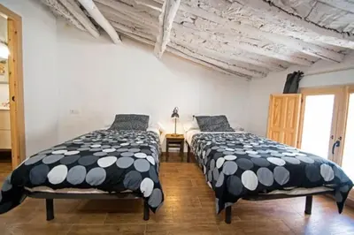 Cama o camas de una habitación en Casa Rural Muro de Aguas - Valdeté