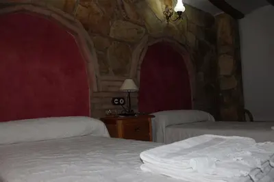 Cama o camas de una habitación en Casa Rural Laura