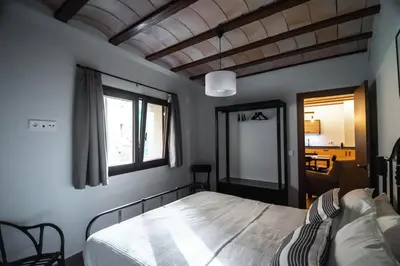 Cama o camas de una habitación en Cal Negret Rural Apartments