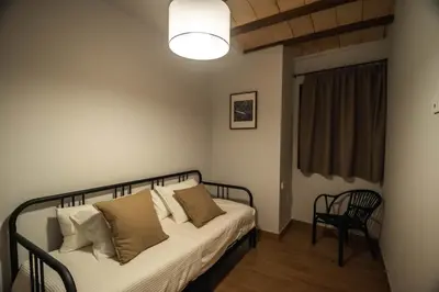 Cama o camas de una habitación en Cal Negret Rural Apartments