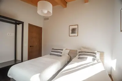 Cama o camas de una habitación en Cal Negret Rural Apartments