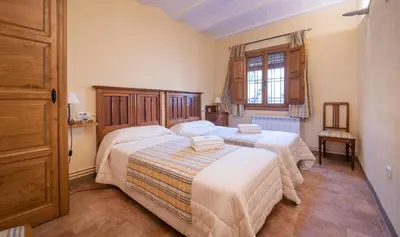 Cama o camas de una habitación en Cal Giral II