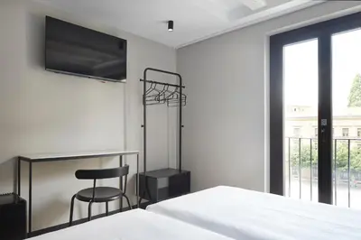 Cama o camas de una habitación en Hostal Espoz y Mina