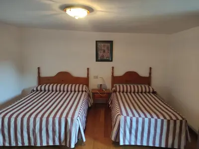 Cama o camas de una habitación en Centro Torla-Ordesa 5pax Apto Miguel