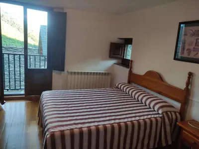 Cama o camas de una habitación en Centro Torla-Ordesa 5pax Apto Miguel