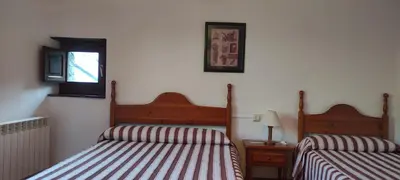 Cama o camas de una habitación en Centro Torla-Ordesa 5pax Apto Miguel