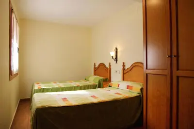Cama o camas de una habitación en Apartamentos Chuanon