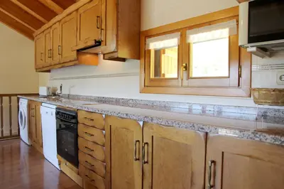 Una cocina o zona de cocina en Apartamentos Chuanon