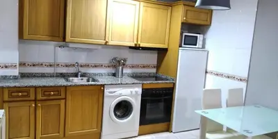 Una cocina o zona de cocina en Apartamentos Tuara
