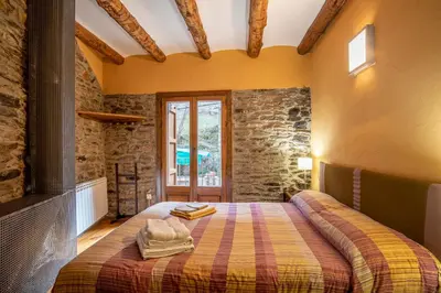 Cama o camas de una habitación en Casa Mora Vall Fosca