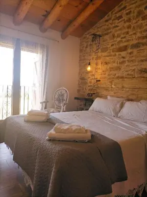 Cama o camas de una habitación en Casa rural EL PAJAR DE TEJEDOR