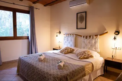 Cama o camas de una habitación en AldeaMia, Cozy villa for 8 people, pool, mountain view, beach at 8 min