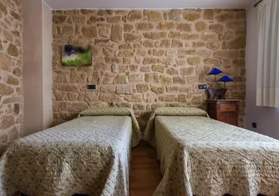 Cama o camas de una habitación en Cal Tomas, Ecoturisme Terra Alta