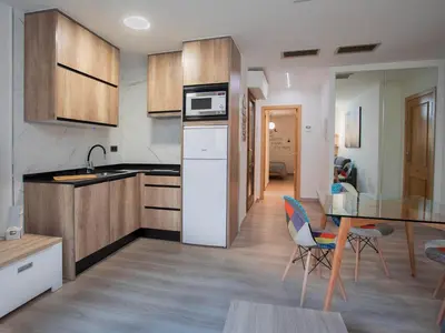 Una cocina o zona de cocina en Apartamentos El Pilar