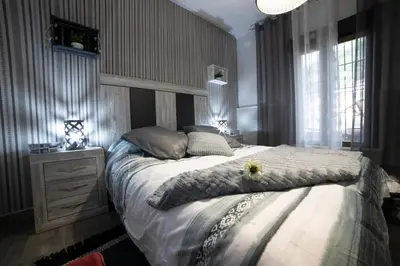 Cama o camas de una habitación en APARTAMENTO LA VEGUILLA