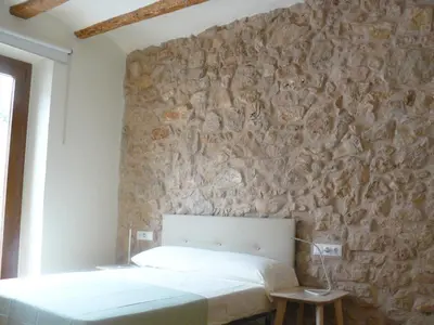 Cama o camas de una habitación en Apartaments Casa el Metge