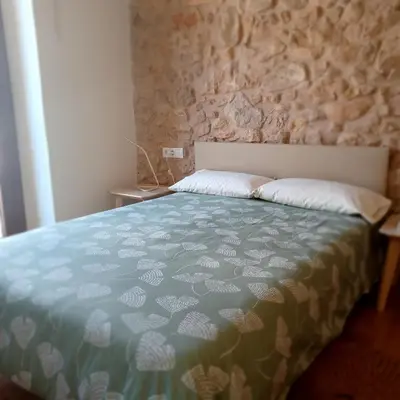 Cama o camas de una habitación en Apartaments Casa el Metge