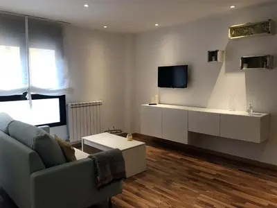 Una televisión o centro de entretenimiento en Suite Anna
