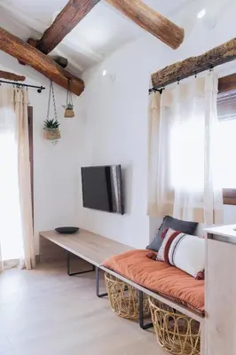Una televisión o centro de entretenimiento en Apartaments la rambla - Garnatxa - 4 persones