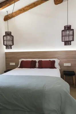 Cama o camas de una habitación en Apartaments la rambla - Garnatxa - 4 persones