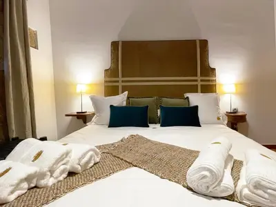 Cama o camas de una habitación en Masia de Queralt Luxury Casa Rural Spa y Vistas