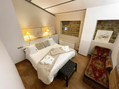 Cama o camas de una habitación en Masia de Queralt Luxury Casa Rural Spa y Vistas