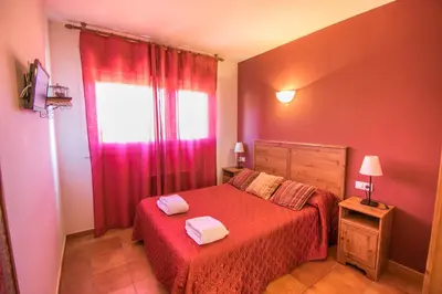 Cama o camas de una habitación en Acogedora casa rural a 10 minutos de Pamplona