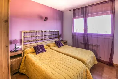 Cama o camas de una habitación en Acogedora casa rural a 10 minutos de Pamplona