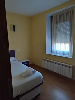 Cama o camas de una habitación en Albergue rural l'Almada de Yebra