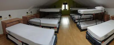 Cama o camas de una habitación en Albergue rural l'Almada de Yebra