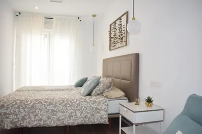 Cama o camas de una habitación en APARTAMENTO ABUELA PILAR