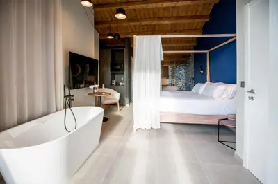 Cama o camas de una habitación en MOCHO-RURAL-HOME ULLDEMO SUITE