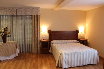 Cama o camas de una habitación en Aparthotel Tres Caminos