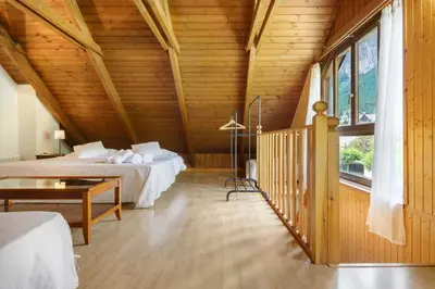Cama o camas de una habitación en Alojamiento Escarrilla Pirineos