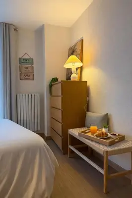Cama o camas de una habitación en El Torreón del Pilar. Opción de parking