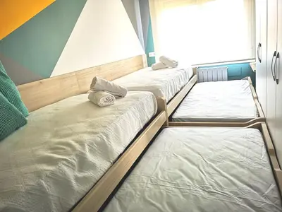 Cama o camas de una habitación en La balconada de la Aljafería con parking privado