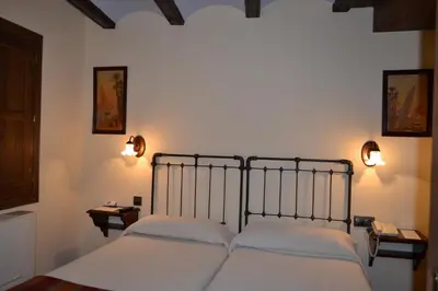 Cama o camas de una habitación en Hostal Santa Agueda